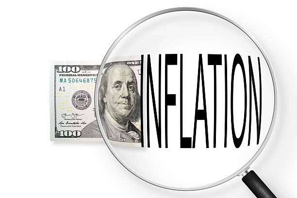 istock One hundred dollars note on a white background. View through magnifying glass. Dollar exchange rate and inflation 2207496757
