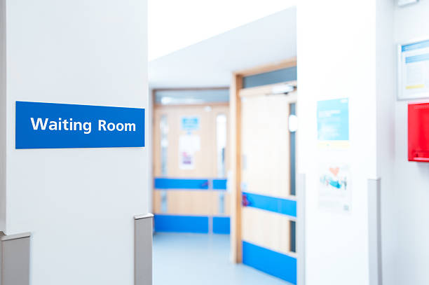 Typical British hospital and GP waiting room sign seen within a patient's medical waiting area. stock photo