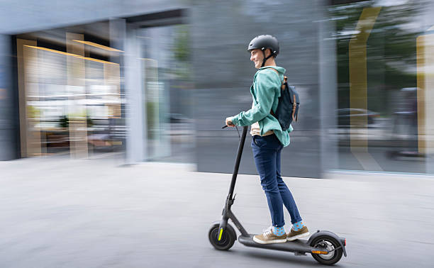 istock Young Man Riding Electric Scooter 2207499011