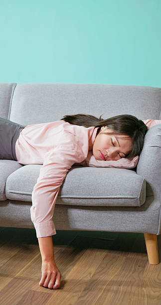 istock asian businesswoman lying flat sofa 2207502672