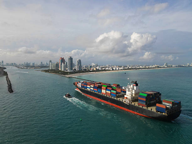 istock Freight container on cargo vessel. Cargo ship vessel leaving port. Container ship. Export and import. Cargo business. Port of Miami. Ship with container, aerial view. Cargo shipyard activities 2207505853