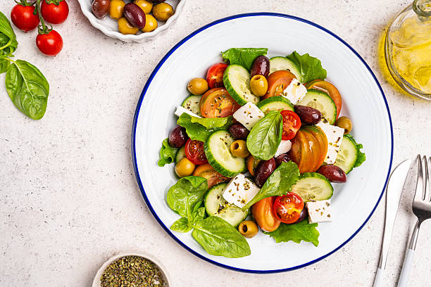 istock Greek salad with fresh vegetables 2207508414