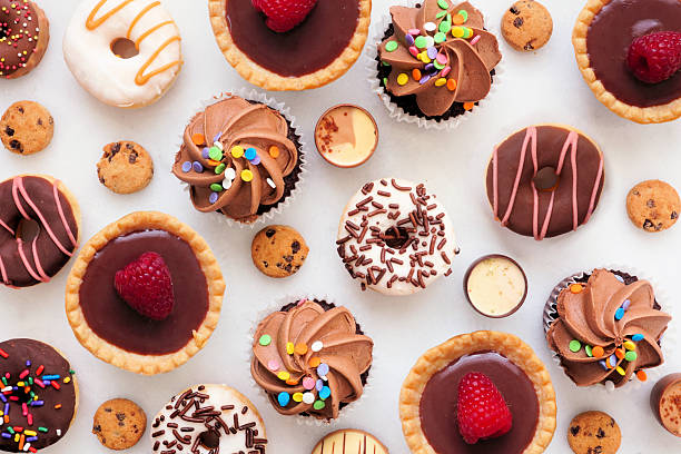 istock Dessert background with a selection of sweets. Top view on a white stone background. 2207512153