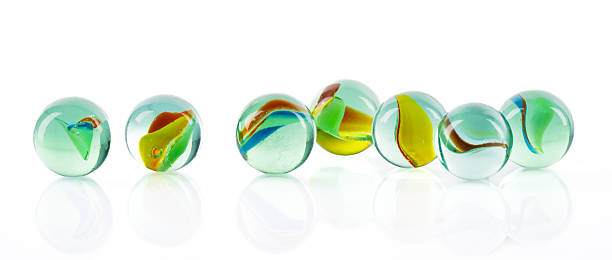 istock Colored glass marbles ball on white background 2207512767