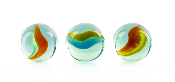 istock Colored glass marbles ball on white background 2207512834