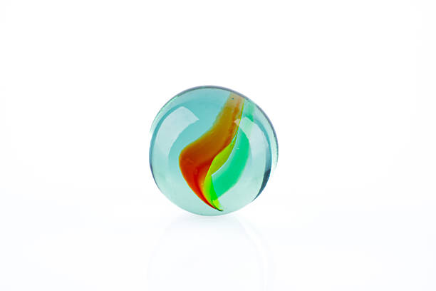 istock Colored glass marbles ball on white background 2207512859