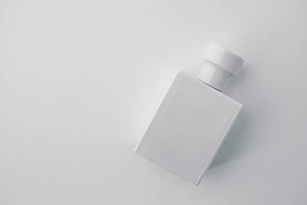 istock Minimalist white perfume bottle with a matte finish standing against a clean white background. Elegant and modern design for fragrance branding, cosmetics, or luxury product presentation 2207513978