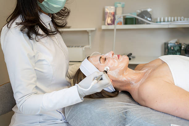 istock Dermatologist performing a skin treatment in a patient 2207514247