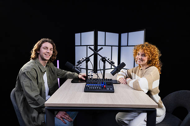 istock Two content creators recording a podcast in a professional studio 2207519324