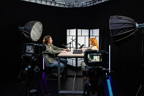 istock Podcasters recording a show in professional studio 2207520098