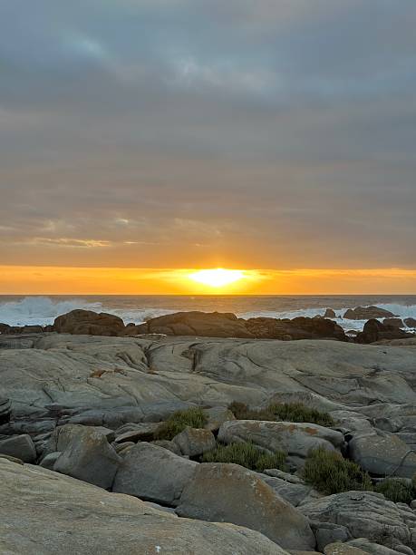 istock Golden sunset over boulders in Paternoster 2207520135