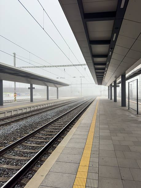 istock Empty Train Station Platform on a Foggy Morning 2207522079