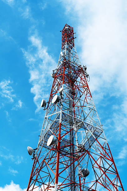 Radio, communication and cell towers on blue sky background