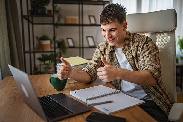 istock young man student talk on video call on laptop and study from home 2207525414