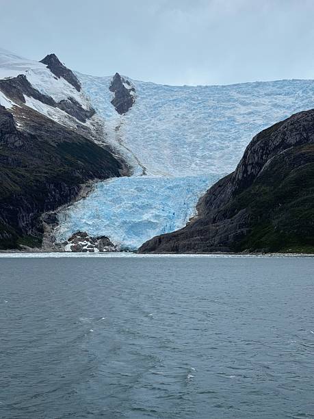 istock Glacier Flowing Into Ocean Fjord View 2207526441
