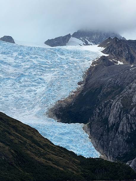 istock Massive Blue Glacier Descending Through Rugged Patagonian Mountain Valley 2207526770