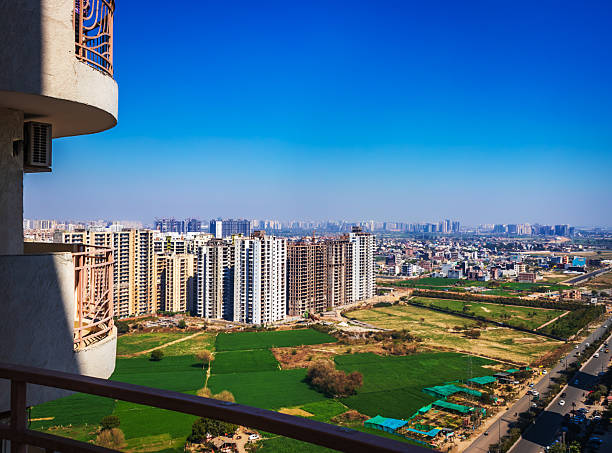 A stunning view of highrise buildings in Noida, Uttar Pradesh, India, showcasing the city's modern skyline and rapid urban development. The tall residential and commercial towers highlight Noida’s growth as a major business and technology hub in India