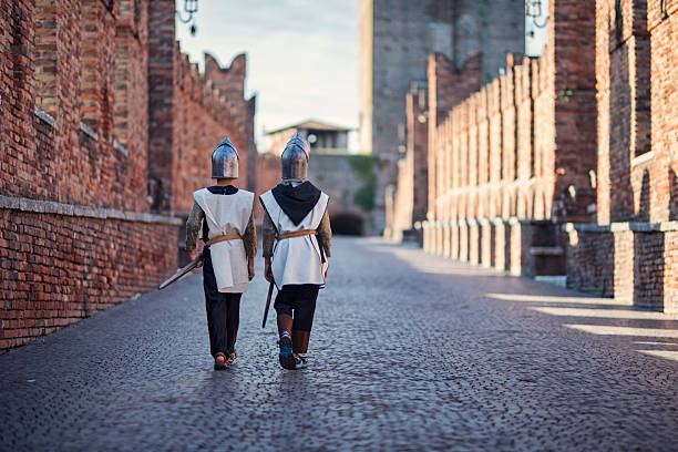 istock Two little knights patrolling a medieval bridge. 2207532458