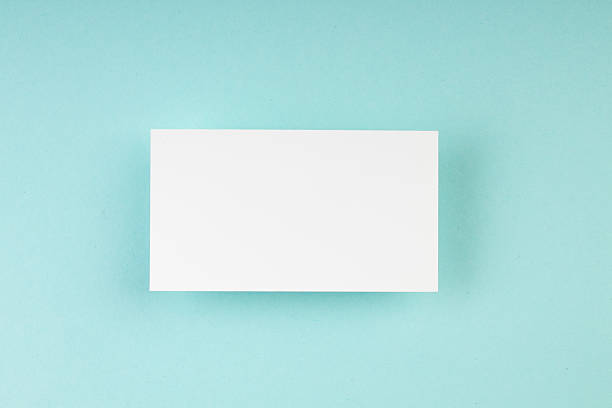 istock Business card blank on colored background. Copy space for text. Top view. 2207533893
