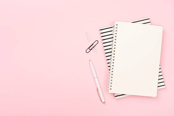 istock Notebook with stationary on color background, top view 2207538485