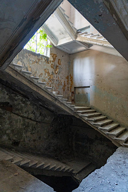 istock Abandoned Stairwell in Sunlit Decay 2207540888