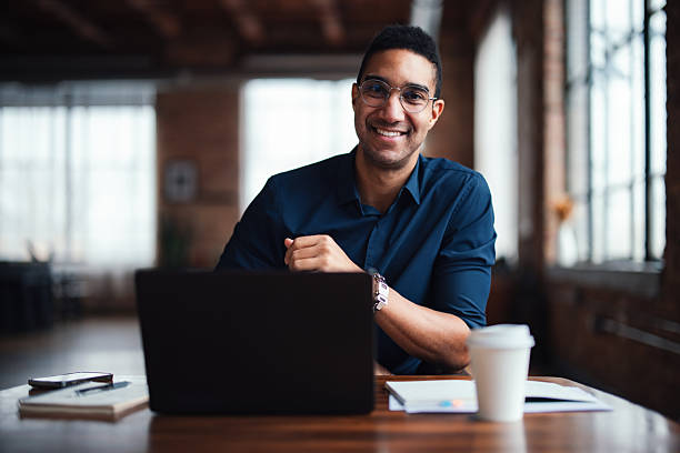 istock Business Professional in an Office Setting with a Laptop 2207541589
