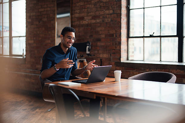 istock Professional Businessman Conducting Virtual Meeting in Spacious Office Setting 2207541594