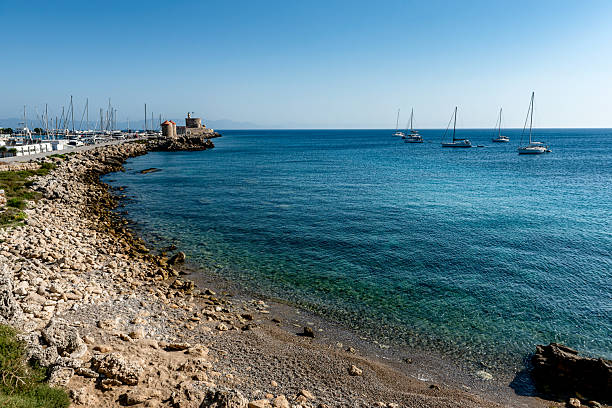 Rhodes Island port. Rhodes harbor and famous windmills, view from the fortifications