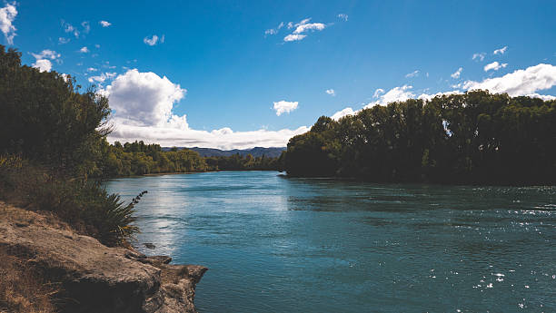 istock Gorgeous blue clutha river new zealand blue sky clear day peaceful 2207543429
