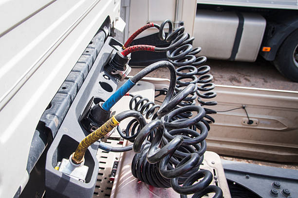 istock Air hoses, power cables, and ABS cables placed on their support after uncoupling the trailer from the truck, close-up. 2207550061