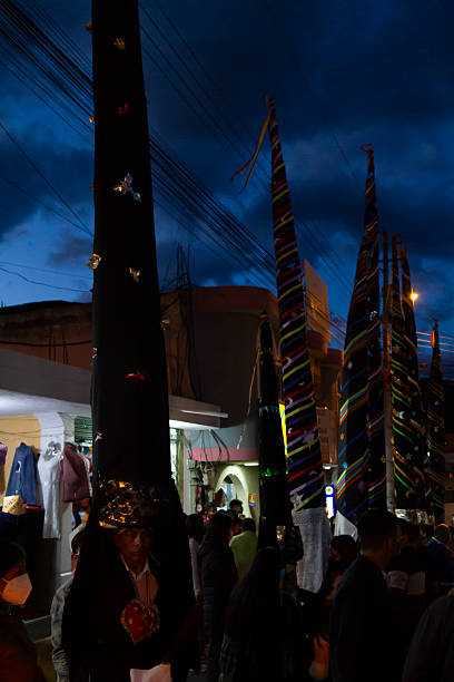 Alangasi, Quito, Pichincha, Ecuador - April 15, 2022: Indigenous people in traditional costumes parading through the streets of Quito during the Diablos de Alangasi procession on Good Friday in Ecuador