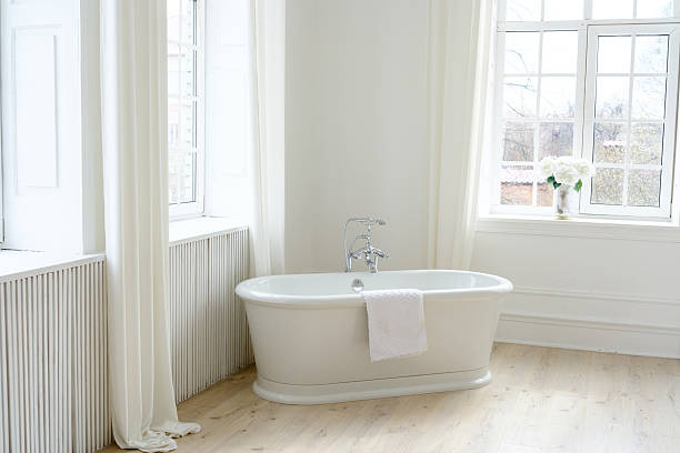 istock Freestanding White Bathtub in Elegant Interior 2207558023