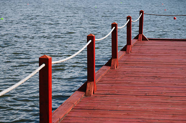 Mooring line rests on the edge of the dock by Clearwater Lake/Burditt Lake in Ontario.