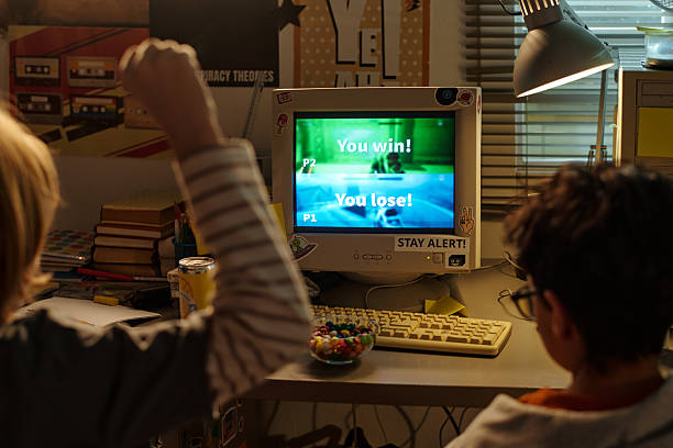 istock Celebrating Victory in Retro Video Game Competition 2207563599