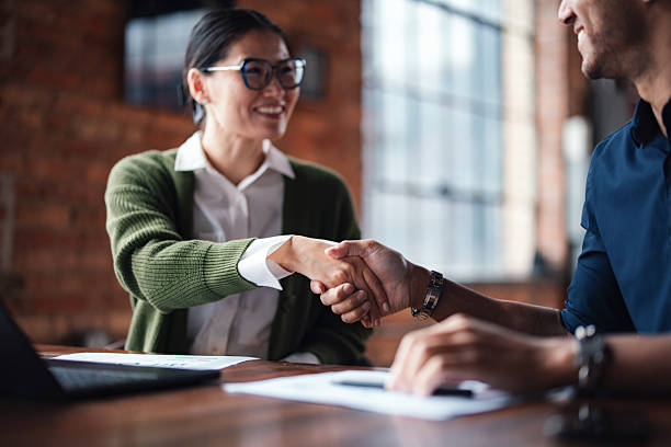 istock Professional Handshake in a Modern Office Environment for Business Agreement 2207564519
