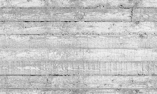 istock Rough white concrete wall, seamless background texture with imprint relief 2207564527
