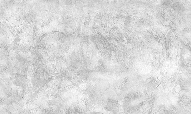 White concrete wall with brush strokes pattern, seamless background stock photo