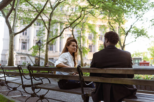 istock City Business Conversation on Park Bench 2207564681
