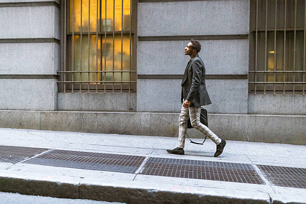 istock Walking Businessman in Evening Cityscape 2207564685