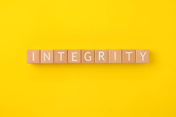 istock Block Words with Integrity on a Yellow Background 2207570407