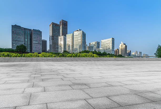 istock Empty brick floor with city skyline background. 2207572291