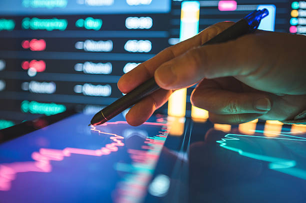 istock Trader using advanced robot trading and ai in investment management investment tools and financial technology in business growth 2207572938