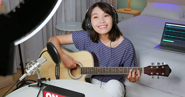 istock woman live broadcasting at home 2207576990
