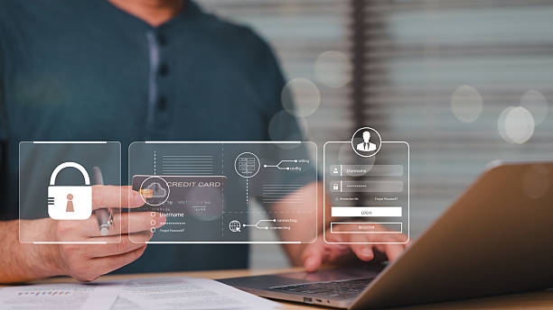 istock A man is using a laptop to view a screen with a credit card and a login screen. He is holding a credit card in his hand 2207577538