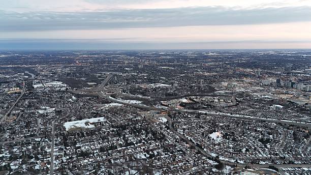 istock Aerial cityscape with snow-covered rooftops at twilight. 2207578793