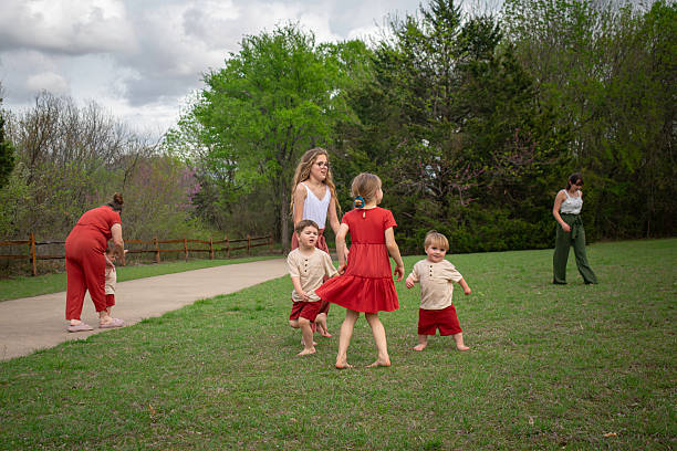 istock large family plays game in meadow 2207581791