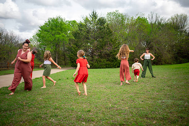 istock large family plays game in meadow 2207581794