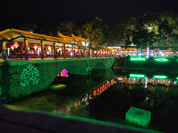 Lighten covered bridge by night in Baoting town, Baoting Li and Miao Autonomous County, an autonomous county in Hainan, China.