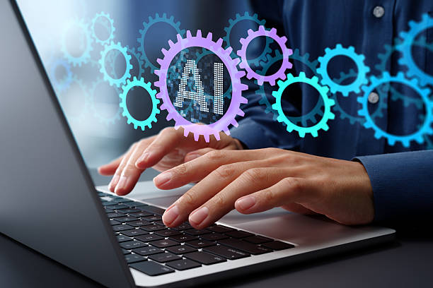 istock AI powered automation for business process and workflow. Many gear icons. Businessman using laptop computer to manage intelligent process automation technology. 2207584611