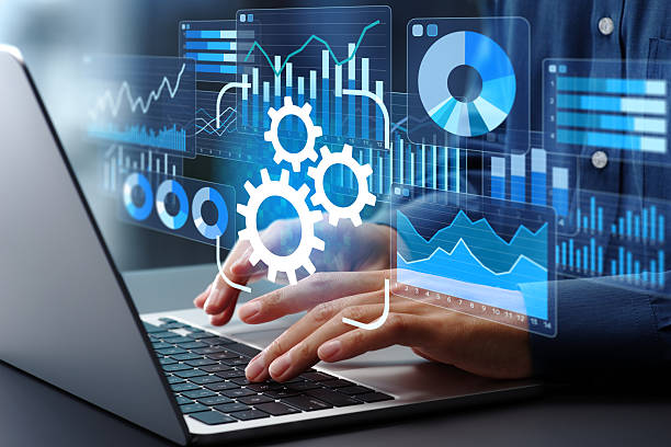 istock Automated reporting and business intelligence. Data automation and dashboards. Businessman using laptop computer to generate and monitor real-time reports. 2207584622